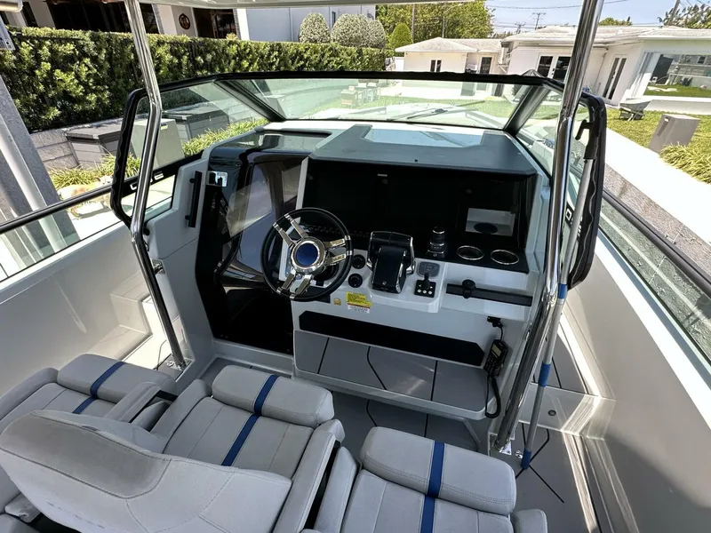Slide: The Image of 2022 Saxdor 320 GTO cockpit with modern controls and seating. - 5