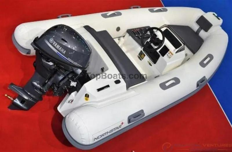 Slide: The Image of 2022 Northstar Axs 3.1 inflatable boat with Yamaha outboard motor on display. - 11