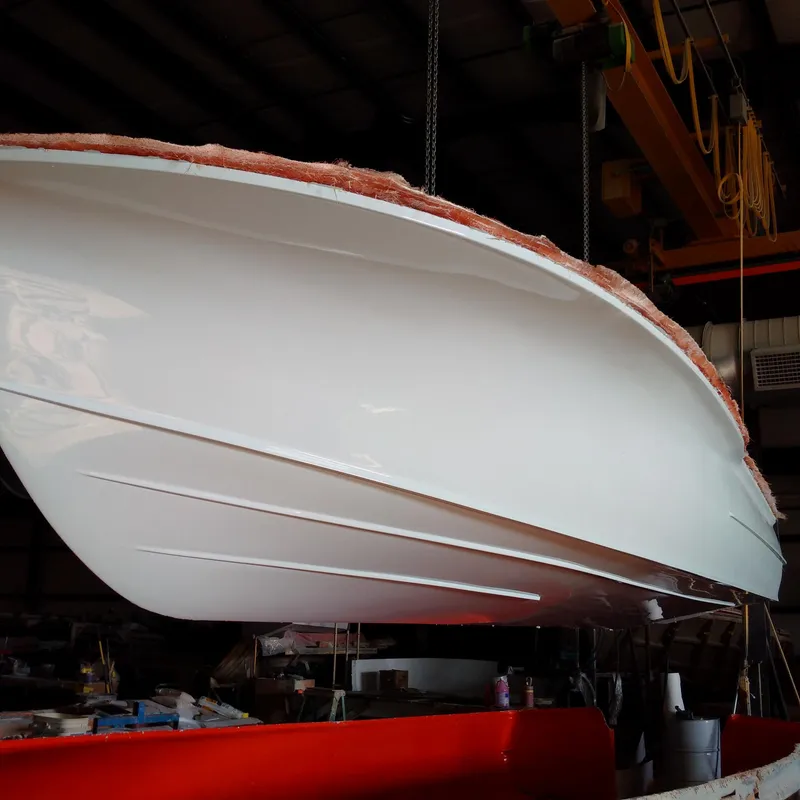 Slide: The Image of 2025 Chaos 21 Tarpon Bay boat hull in a workshop setting. - 15