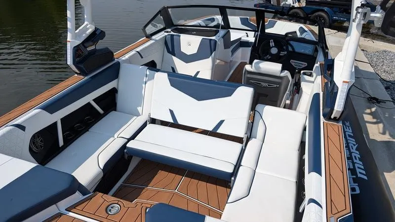 Slide: The Image of 2025 Nautique Super Air Nautique GS22 interior with modern seating and dashboard design. - 9
