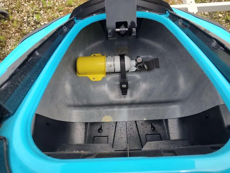 Slide: The Image of Open storage compartment of 2022 Yamaha WaveRunner GP1800R with safety equipment inside. - 5