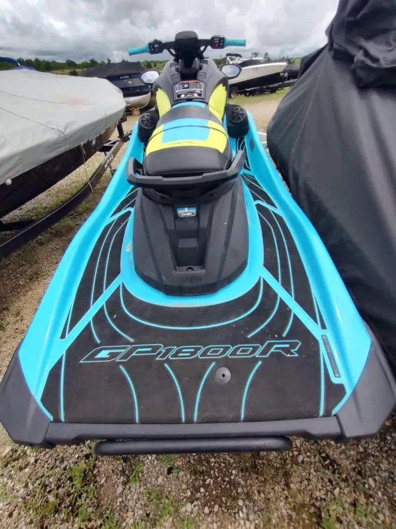Slide: The Image of 2022 Yamaha WaveRunner GP1800R in blue and black, parked outdoors. - 6