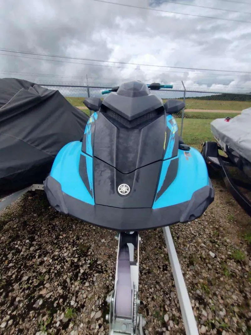 Slide: The Image of 2022 Yamaha WaveRunner GP1800R in blue, parked outdoors on a trailer. - 8