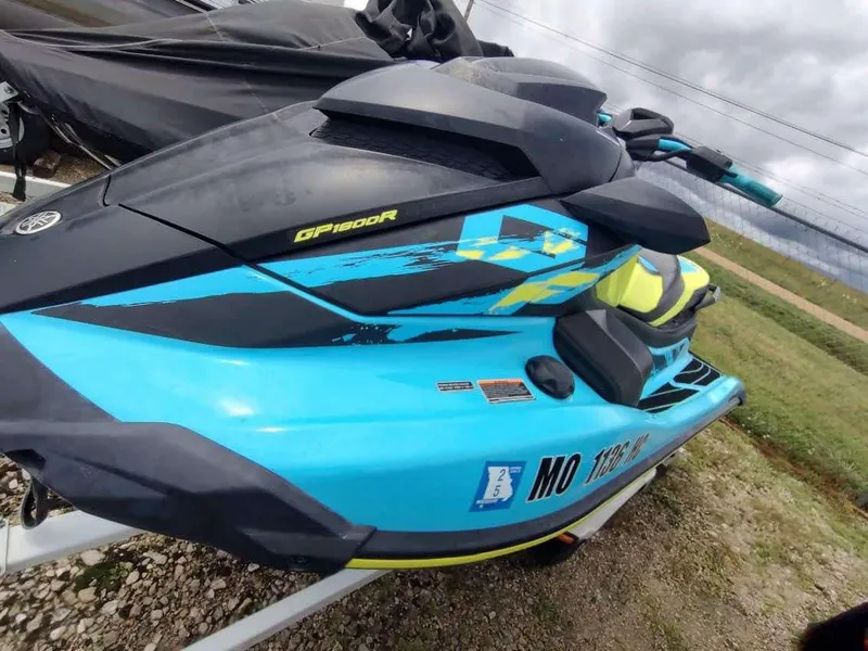 Slide: The Image of 2022 Yamaha WaveRunner GP1800R in blue and black, parked on a trailer. - 9