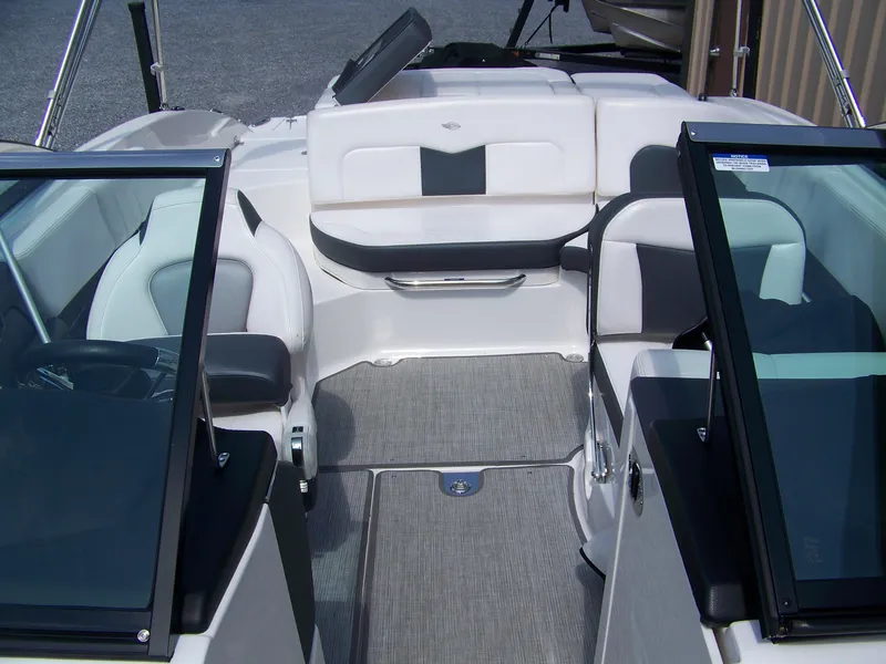 Slide: The Image of 2021 Chaparral 237 SSX boat interior with sleek seating and modern design. - 13
