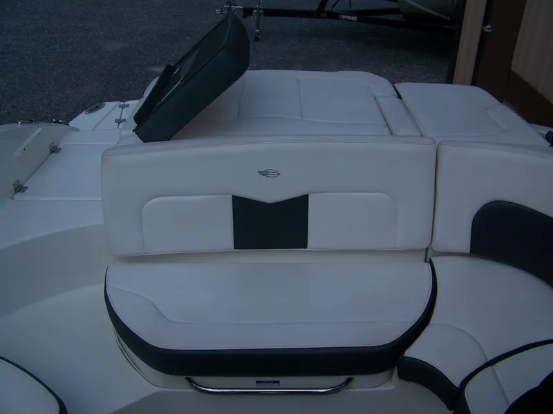 Slide: The Image of 2021 Chaparral 237 SSX boat interior seating with white and black upholstery. - 6