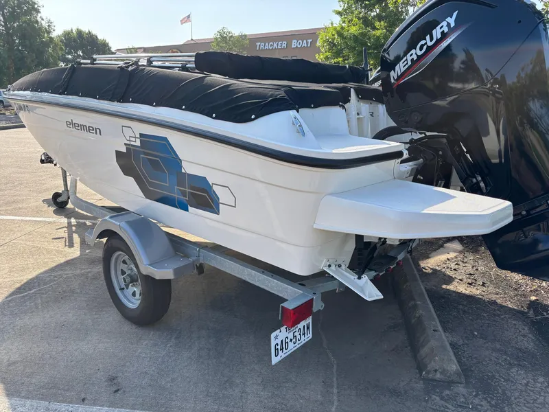 Slide: The Image of 2021 Bayliner Element E16 boat on trailer with Mercury outboard motor. - 10
