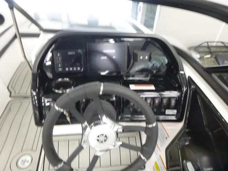 Slide: The Image of 2025 Yamaha Boats 195S dashboard with steering wheel and control panel. - 8