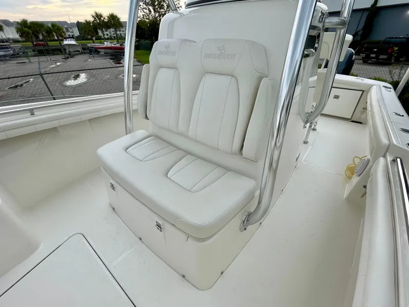 Slide: The Image of 2019 Regulator 23 boat with white seating and stainless steel frame. - 14