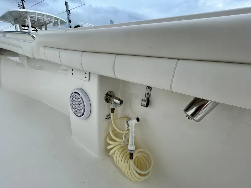 Slide: The Image of 2019 Regulator 23 boat deck with hose, speaker, and rod holder. - 20