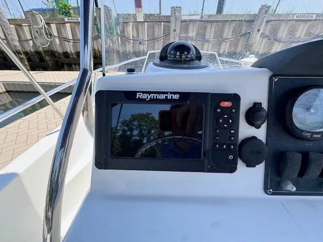 Slide: The Image of Raymarine navigation system on 2012 Boston Whaler 180 Dauntless boat dashboard. - 21