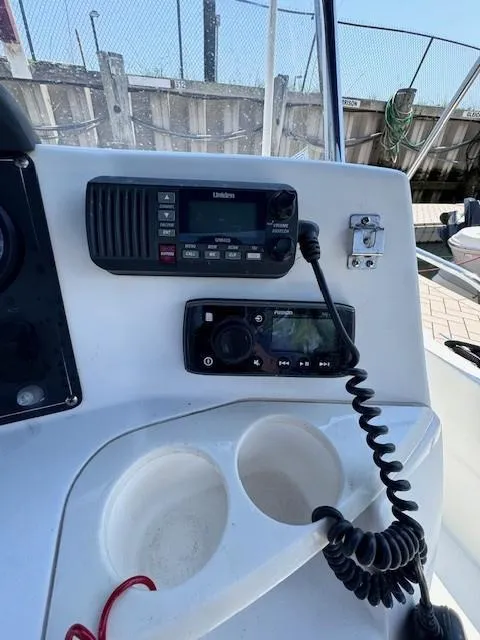 Slide: The Image of Control panel of a 2012 Boston Whaler 180 Dauntless boat with communication devices. - 23