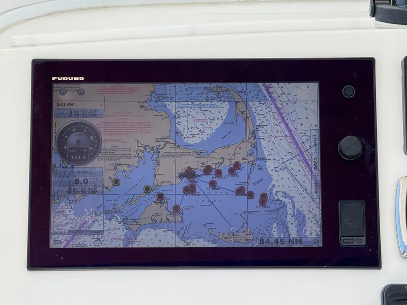 Slide: The Image of Furuno marine GPS display on 2017 Regulator 34SS, showing nautical chart and navigation data. - 10