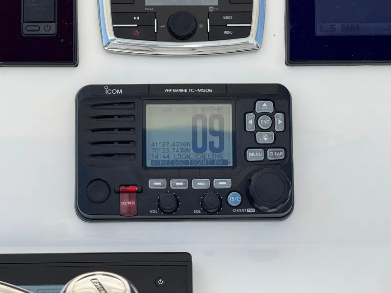 Slide: The Image of ICOM VHF Marine IC-M506 radio on 2017 Regulator 34SS boat dashboard. - 12