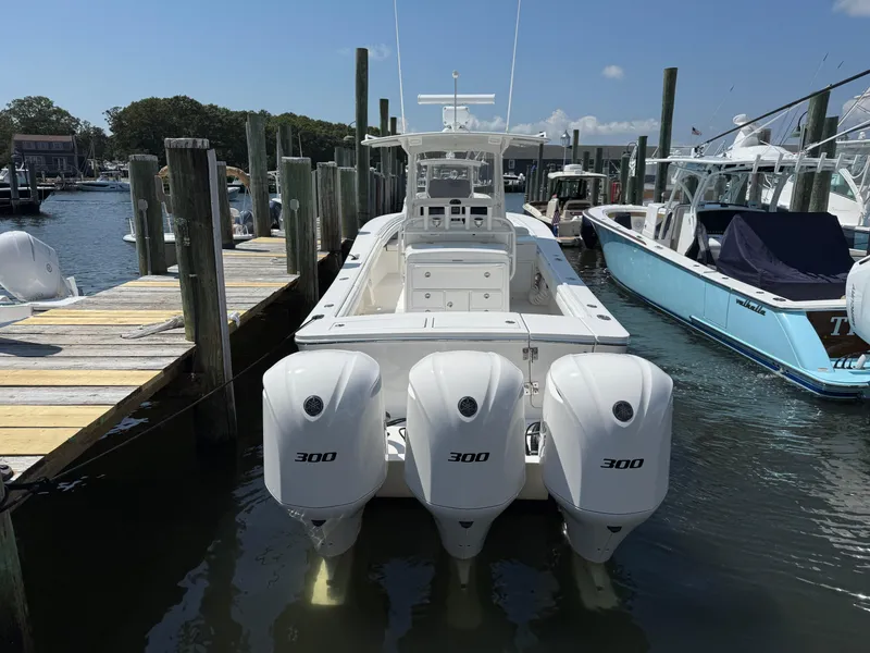 Slide: The Image of 2017 Regulator 34SS boat docked with triple 300 horsepower engines. - 13