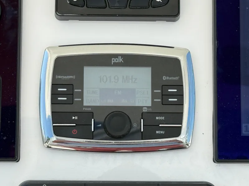 Slide: The Image of Polk audio system on 2017 Regulator 34SS boat, displaying 101.9 MHz frequency. - 14