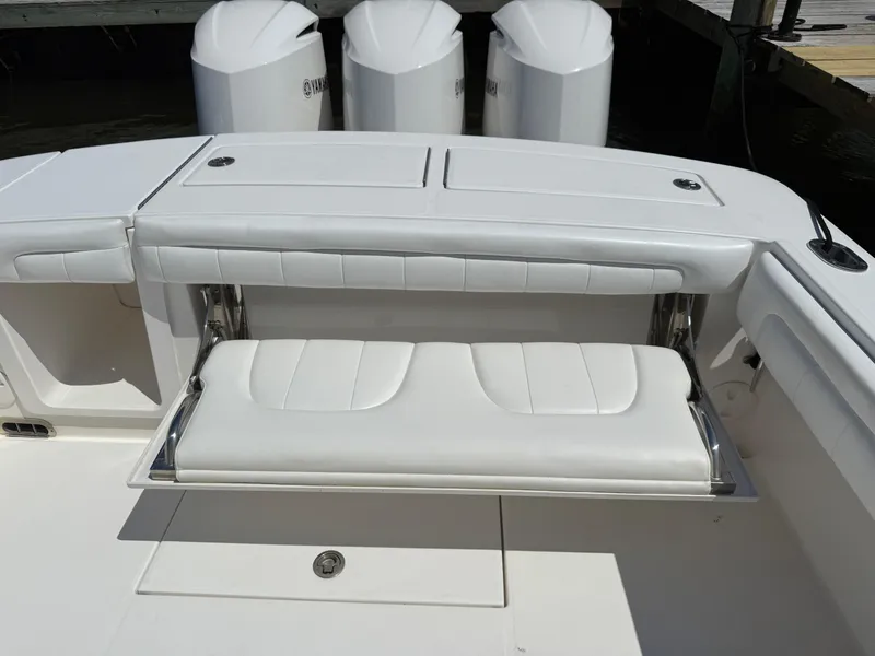 Slide: The Image of 2017 Regulator 34SS boat with foldable white bench seat and Yamaha engines. - 18