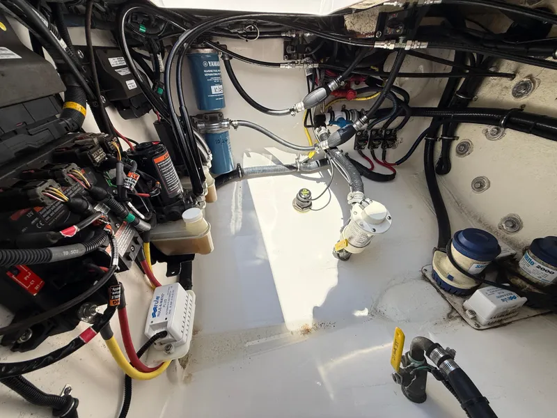 Slide: The Image of Engine compartment of a 2017 Regulator 34SS boat, showcasing wiring and components. - 21