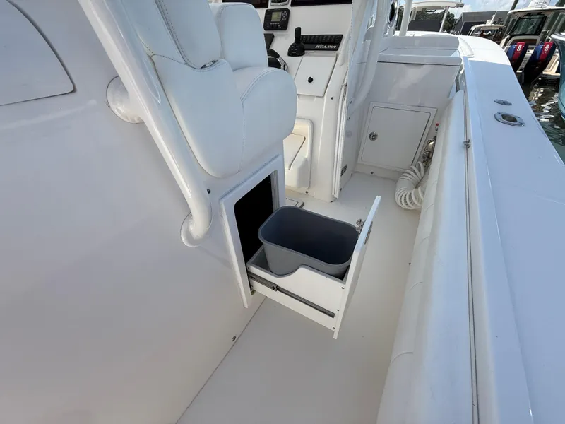 Slide: The Image of 2017 Regulator 34SS boat interior with open storage drawer and seating. - 31