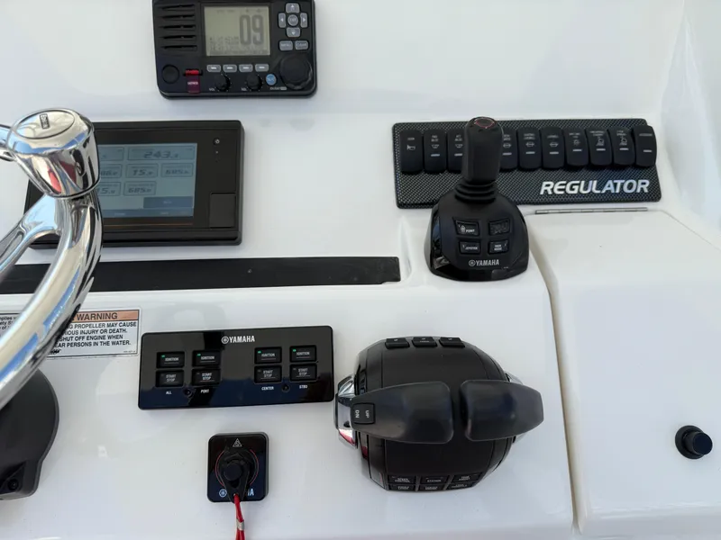 Slide: The Image of Control panel of a 2017 Regulator 34SS boat with Yamaha controls and joystick. - 36
