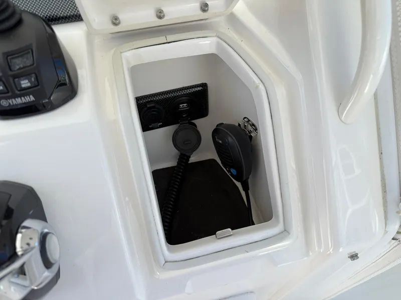Slide: The Image of 2017 Regulator 34SS boat console with Yamaha controls and communication equipment. - 38