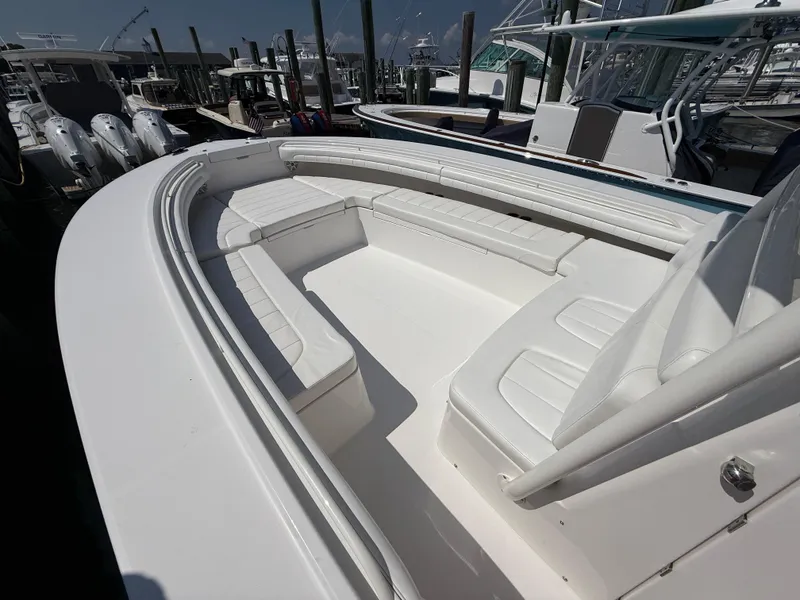 Slide: The Image of 2017 Regulator 34SS boat with spacious white seating area at dock. - 47