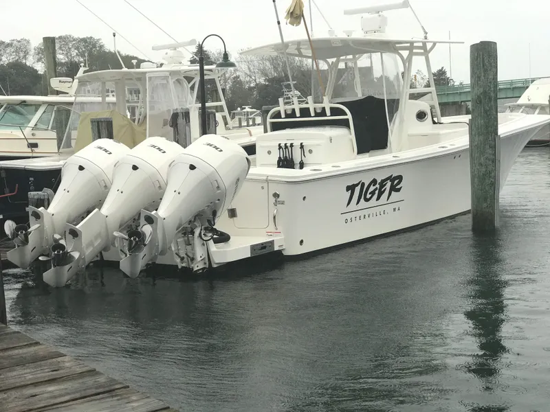 Slide: The Image of 2017 Regulator 34SS boat docked with triple outboard engines in Osterville, MA. - 5