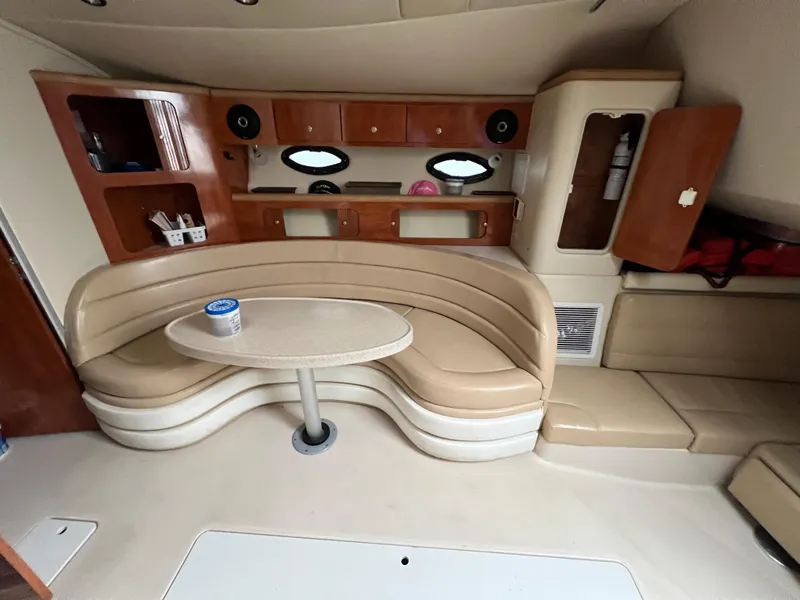 Slide: The Image of Interior of 2004 Wellcraft 3700 Martinique yacht with beige seating and wooden cabinetry. - 17