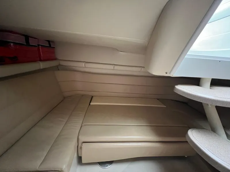 Slide: The Image of Interior cabin of 2004 Wellcraft 3700 Martinique with beige seating and storage. - 20