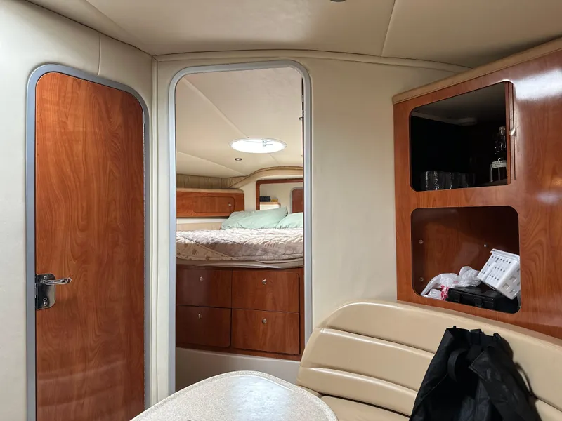 Slide: The Image of Interior of 2004 Wellcraft 3700 Martinique yacht with cozy cabin and wooden finishes. - 21