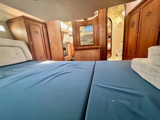 Slide: The Image of Interior of 1993 Hunter Legend 40.5 sailboat with cozy cabin and wooden furnishings. - 15