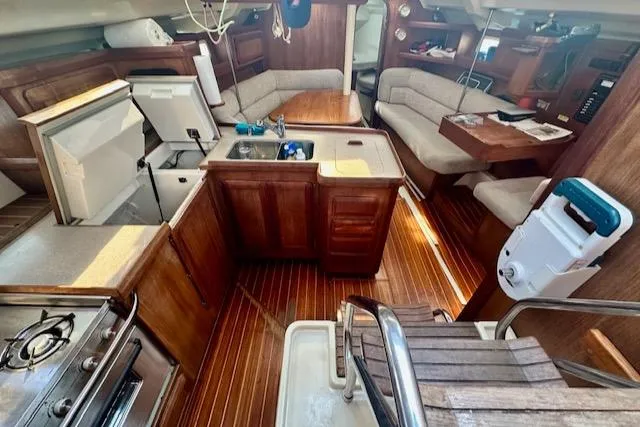 Slide: The Image of Interior of 1993 Hunter Legend 40.5 sailboat with kitchen and seating area. - 24