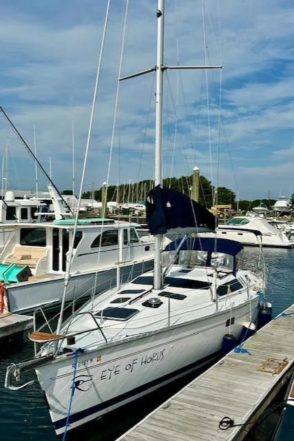 Slide: The Image of Sailboat "Eye of Horus," Hunter Legend 40.5, 1993, docked at marina. - 35