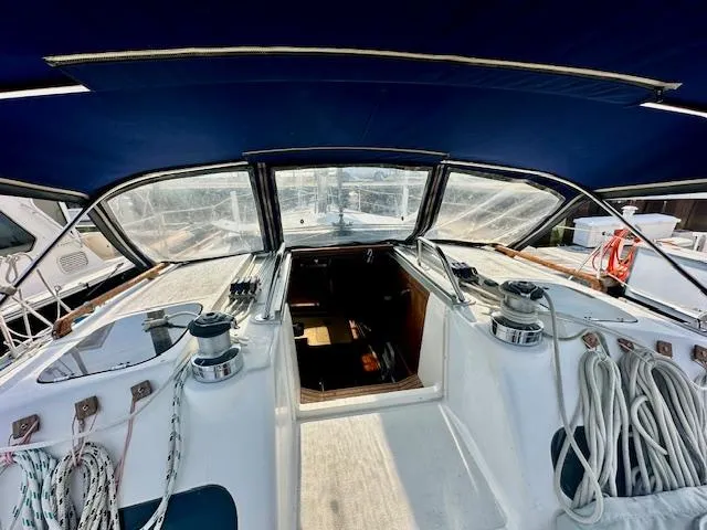 Slide: The Image of Cockpit of 1993 Hunter Legend 40.5 sailboat with ropes and winches. - 6