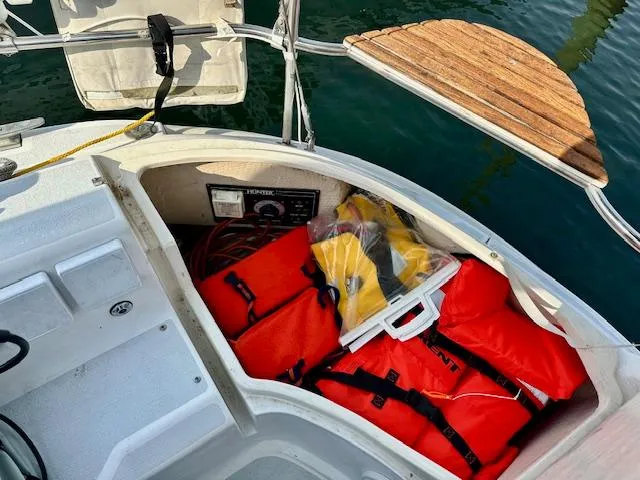 Slide: The Image of Storage compartment on 1993 Hunter Legend 40.5 sailboat with life jackets and safety gear. - 8