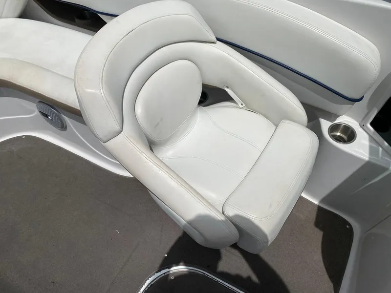 Slide: The Image of White seating on 2007 Four Winns 240 Horizon boat, featuring cushioned design and cup holder. - 15
