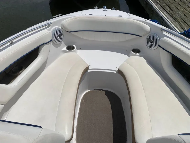 Slide: The Image of 2007 Four Winns 240 Horizon boat interior with white seating and cup holders. - 17