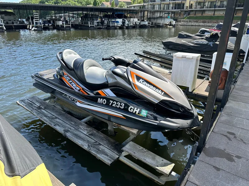 Slide: The Image of 2018 Kawasaki Jetski Ultra LX docked at a marina, ready for water adventures. - 2