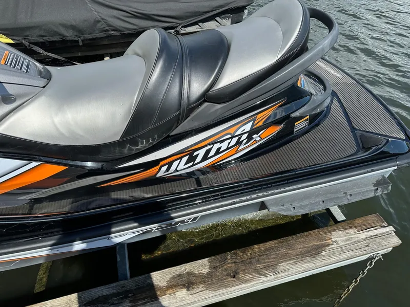 Slide: The Image of 2018 Kawasaki Jetski Ultra LX on dock, featuring sleek design and comfortable seating. - 7