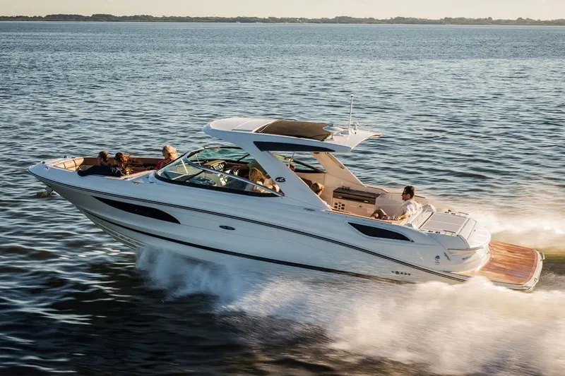 Slide: The Image of Manufacturer Provided Image: 2019 Sea Ray SLX 350 cruising on open water with passengers. - 2