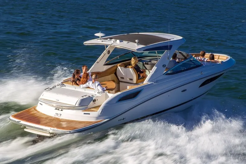 Slide: The Image of Manufacturer Provided Image: 2019 Sea Ray SLX 350 cruising on water with passengers enjoying the ride. - 4