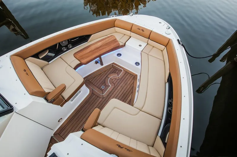 Slide: The Image of Manufacturer Provided Image: 2019 Sea Ray SLX 350 boat with luxurious tan seating and wooden deck. - 5