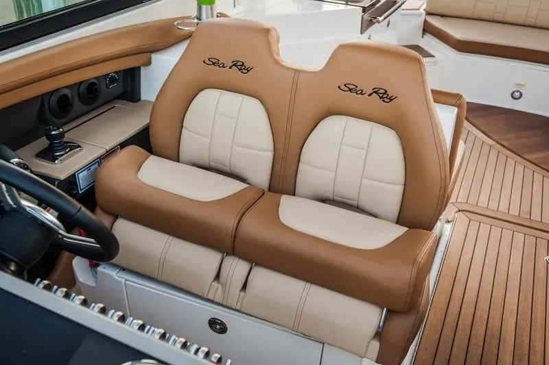 Slide: The Image of Manufacturer Provided Image: 2019 Sea Ray SLX 350 boat interior with tan and white leather seats. - 7