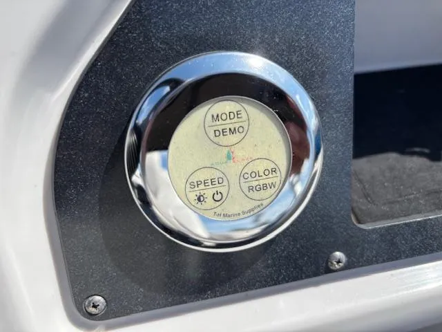 Slide: The Image of Control panel on a 2022 Sweetwater 2286 boat, featuring mode, speed, and color settings. - 21