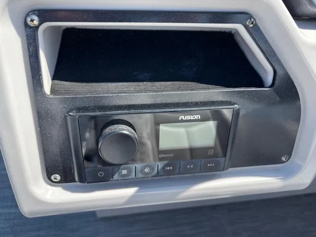 Slide: The Image of Fusion audio system on 2022 Sweetwater 2286 boat dashboard. - 23