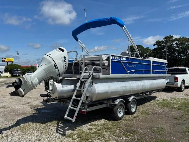 Slide: The Image of 2022 Sweetwater 2286 pontoon boat on trailer with blue canopy and Suzuki outboard motor. - 7