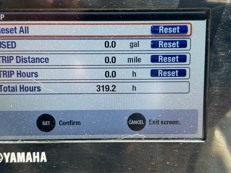 Slide: The Image of Dashboard display of a 2018 Grady-White Freedom 235 boat showing trip and total hours. - 22