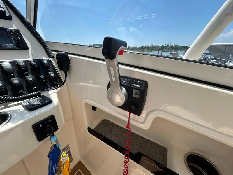 Slide: The Image of 2018 Grady-White Freedom 235 boat control panel with Yamaha throttle. - 23