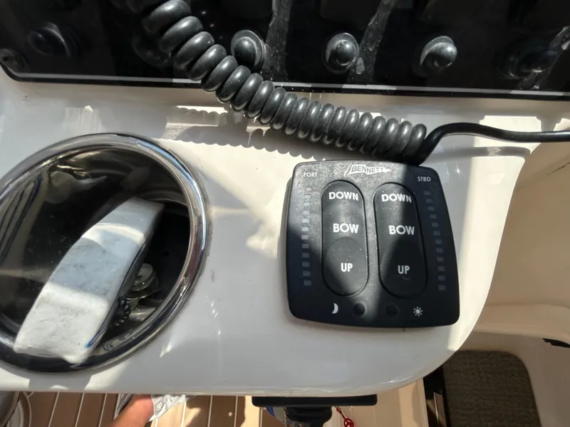 Slide: The Image of Control panel on a 2018 Grady-White Freedom 235 boat dashboard. - 24