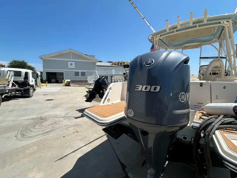 Slide: The Image of 2018 Grady-White Freedom 235 boat with Yamaha 300 engine at a marina. - 3